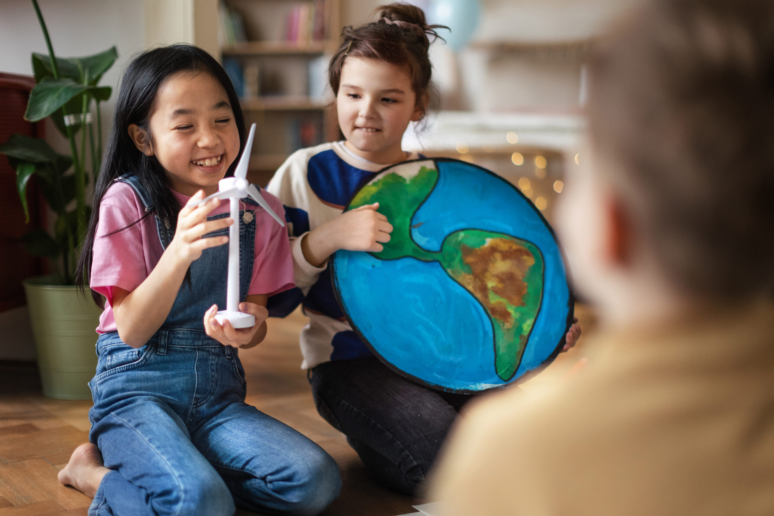 Little children talking about environmental topics in the room.